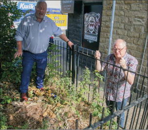 NEGLECTED: Councillors Stephen Bullcock and Philip Wright survey one of the overgrown areas blighting Kingstone.