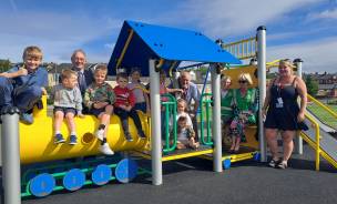 Young Milton residents enjoying the new equipment at Forge Playing Fields with ward councillors, council staff and members of Mates of Milton.