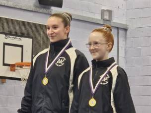 Ellie Hardy, left, and Jessica Wilson with their gold medals.