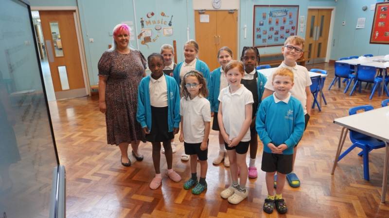 The school choir with teacher Sarah Burgess.