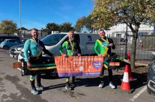 Main image for Fundraising friends stick together to take world record