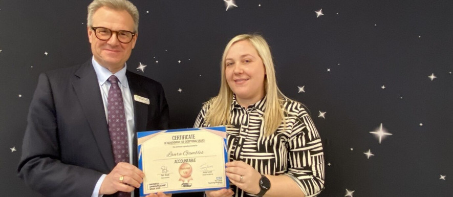 Laura Gambles receives her certificate from Trust Chief Executive Officer, Professor Phil Wood.