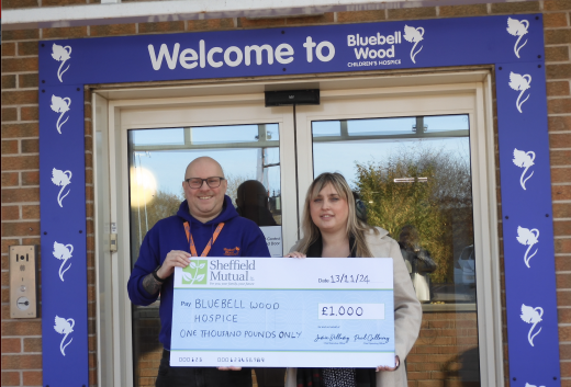 Business Development Manager, Megan presenting the cheque to Bluebell Wood.