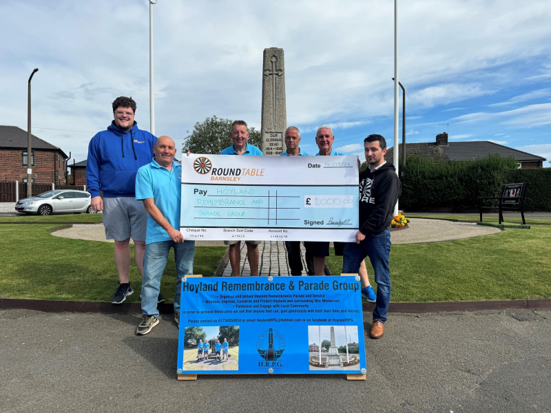 Hoyland Remembrance and Parade Group receive their donation.