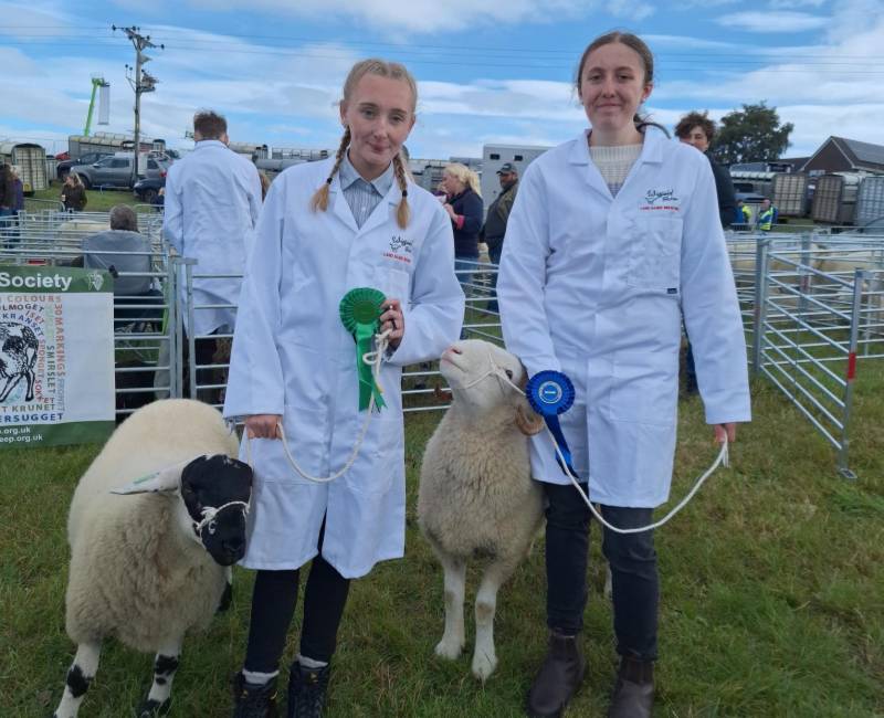 Ashleigh Braisby (left) with her fourth-place rosette and Millie Taylor (right) with her second-place rosette.